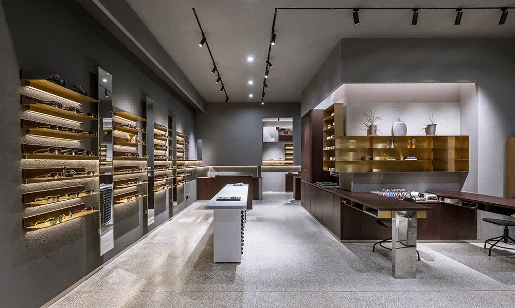 Custom metal display rack by NEXTOP in a luxury eyewear store