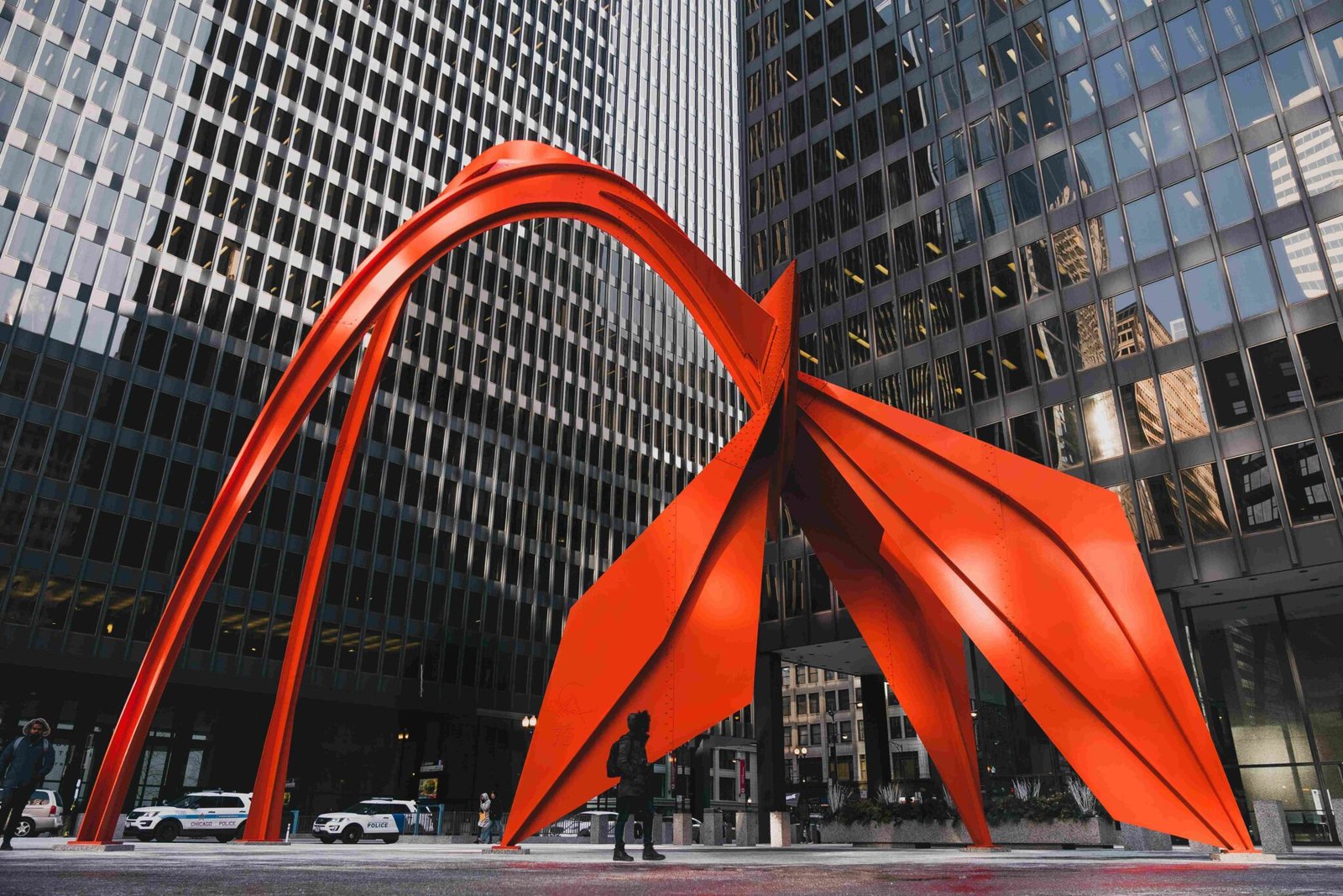 Large street-side modern metal sculpture in public urban space, contemporary design