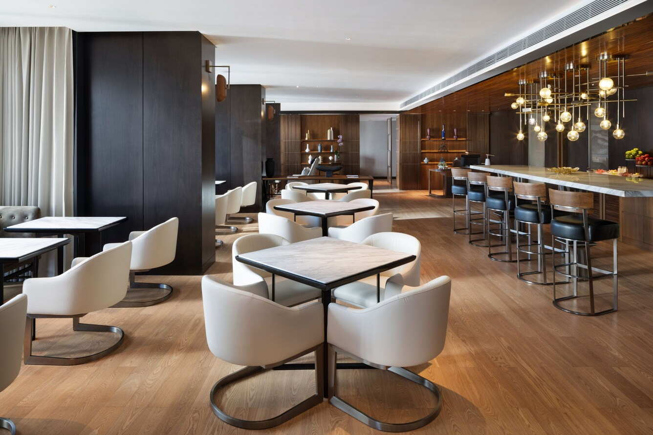 Custom dining tables, chairs and metal accent features by NEXTOP in hotel restaurant