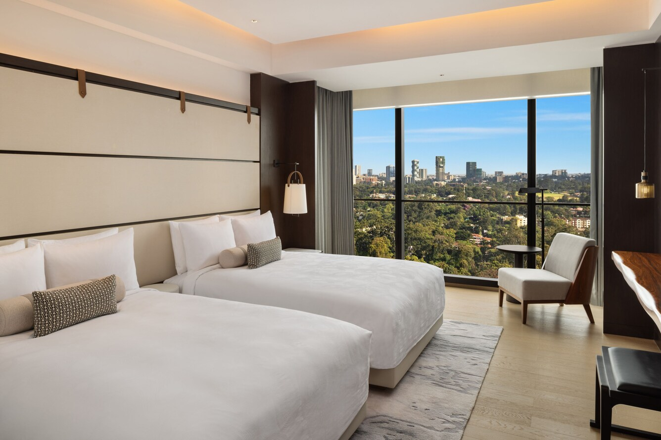 Custom double-bedroom furniture set by NEXTOP in a hospitality room